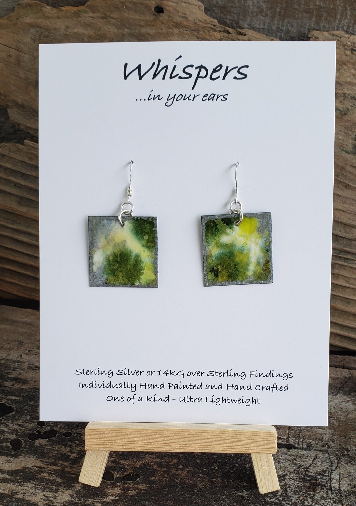 Hand painted watercolor ultra lightweight paper earrings. Lilypad with silver painted edges. Back is painted with similar colors and design. Square in shape. Sterling silver findings. Hangs 1 1/4" in Length