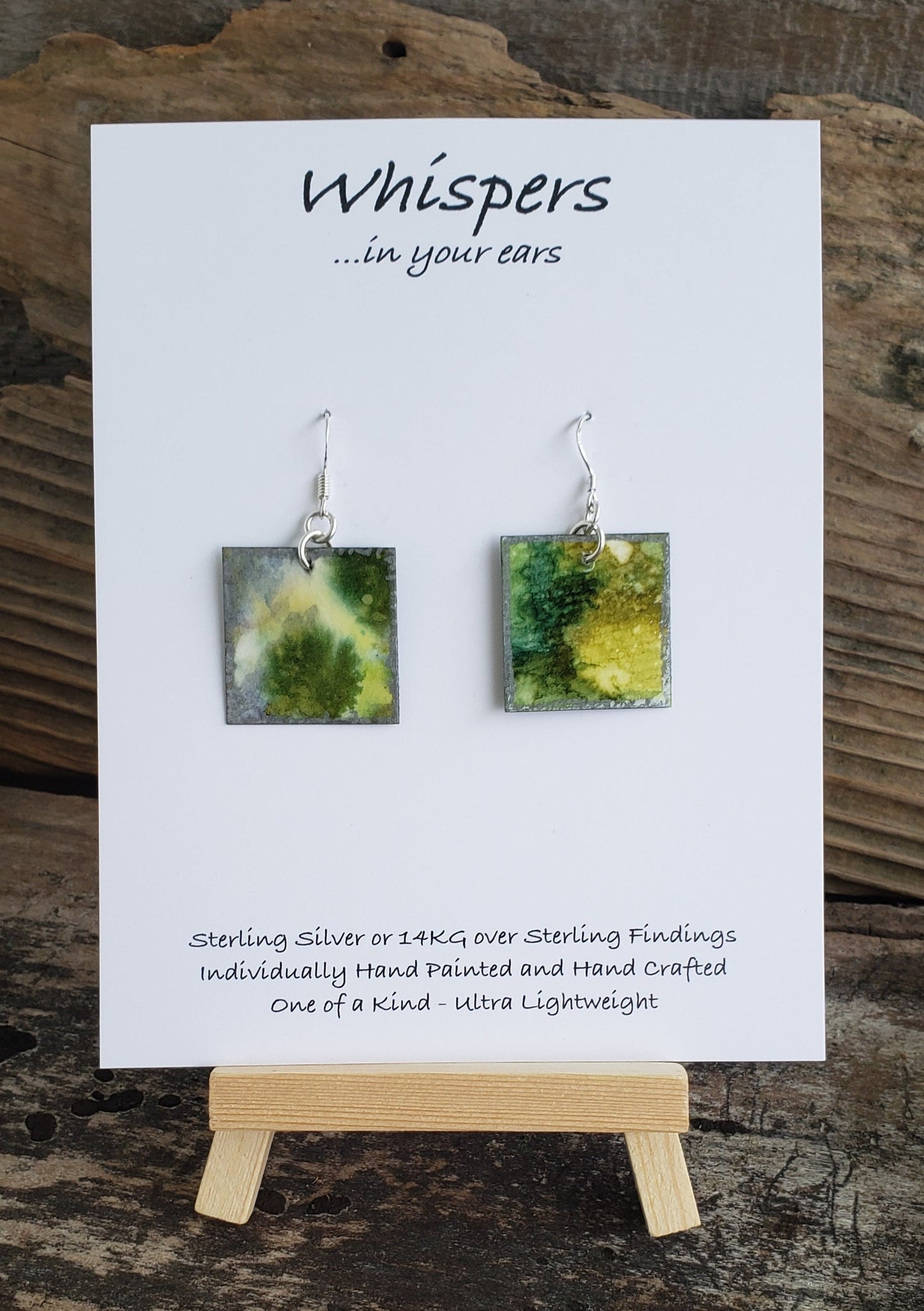 Hand painted watercolor ultra lightweight paper earrings. Lilypad with silver painted edges. Back is painted with similar colors and design. Square in shape. Sterling silver findings. Hangs 1 1/4" in Length