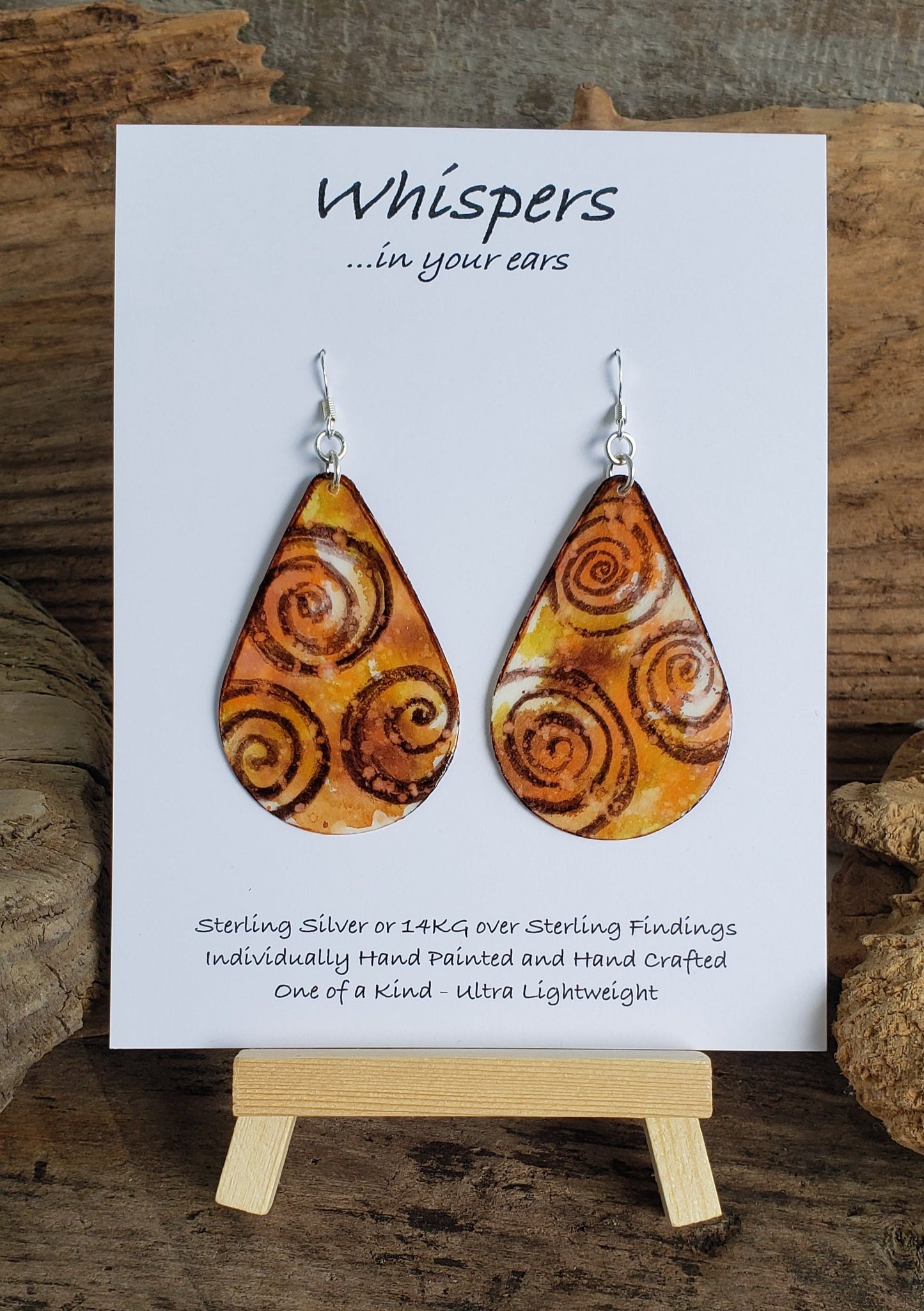 Earth tone Swirls Ultra lightweight Hand painted paper earrings. Watercolor, teardrop shape. Back is painted with complimentary colors. Sterling silver findings 2 1/2" in Length