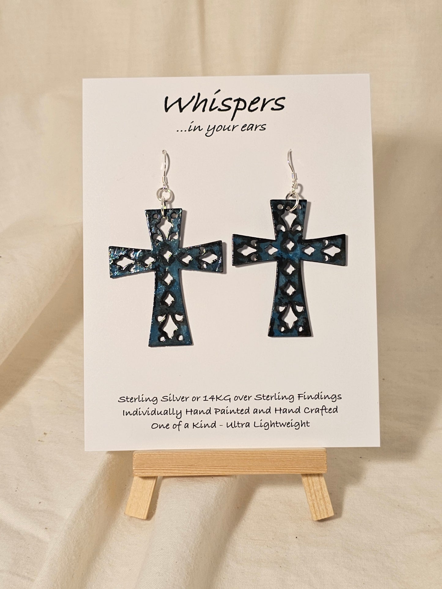 Turquoise Blue Faux Enamel Hand Painted Wood Cross Earrings. Painted to have an aged distressed look. 2" Wood Cross. Back is painted to match. Enameled for durability. Sterling Silver findings. Hangs 2 1/4" in length