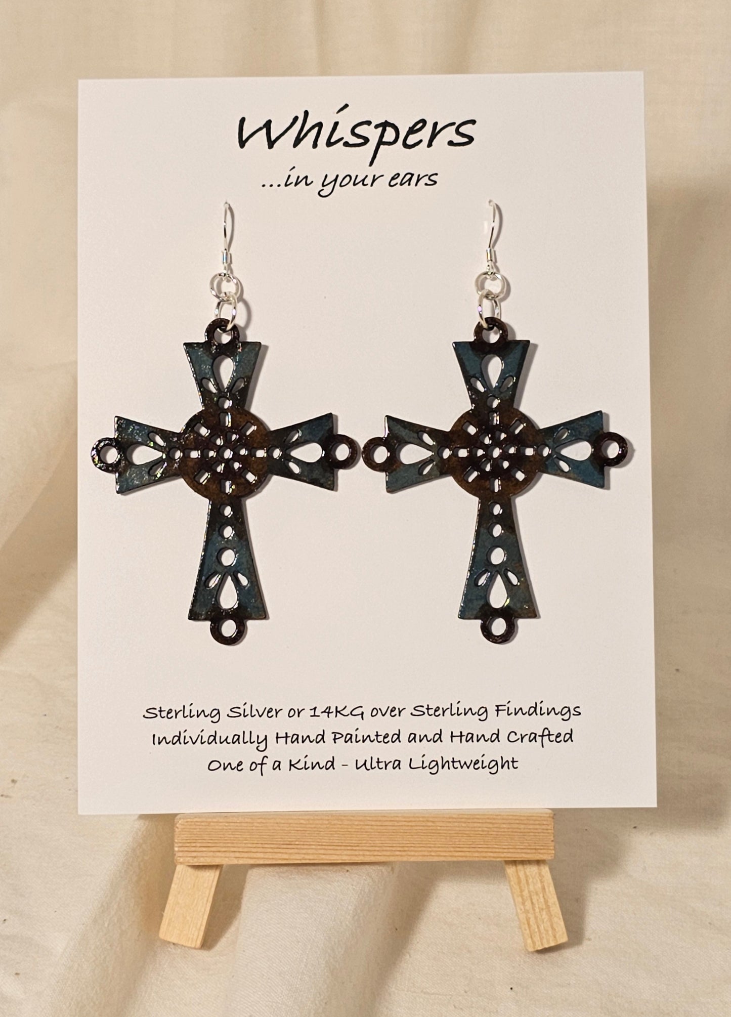 Brown and Turquoise Blue Faux Enamel Hand Painted Celtic Wood Cross Earrings. Cross and circle center painted to look aged and distressed. 2 1/4" Cross. Back is painted to match. Enameled for durability. Sterling Silver findings. Hangs 2 3/4" in length