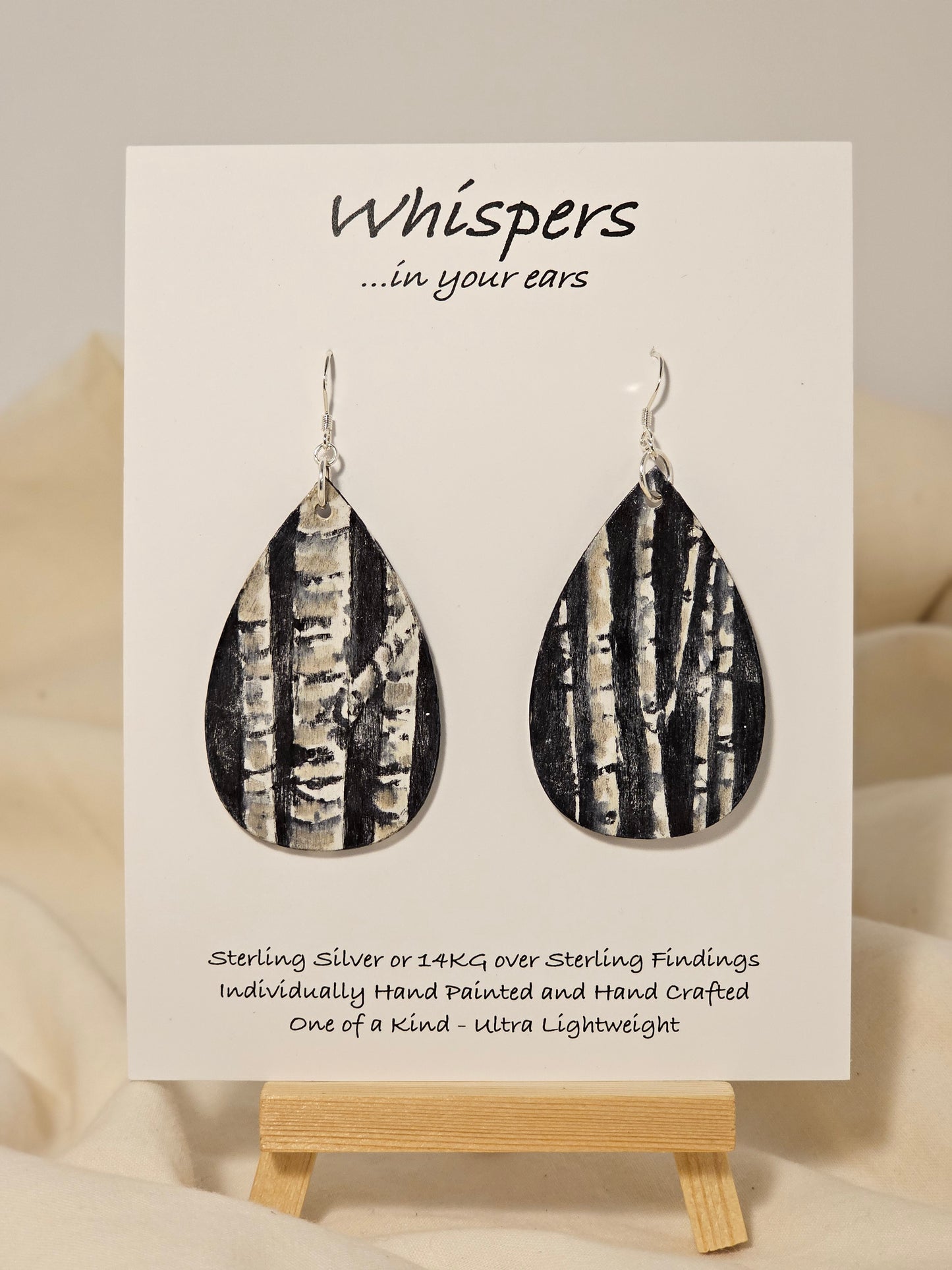 Birch Trees Hand Painted Wood Earrings. 2" Teardrop. Painted birch tree scene on black background. Back is painted to match. Enameled for durability. Sterling Silver findings. Hangs 2 1/2" in length