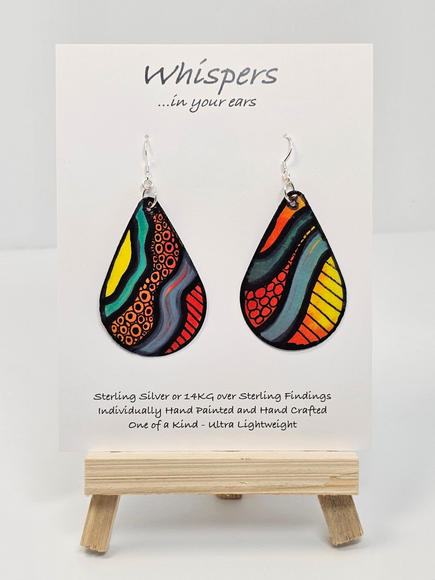 1980s Memphis Design Hand Painted Paper Earrings, 2" Tear drop shape heavy pattern and bold primary colors. Outlined in black. Back of earring similar pattern. Resin coated for durability. Sterling silver ear wires and findings. Ultra light weight. Hangs 2 1/4"