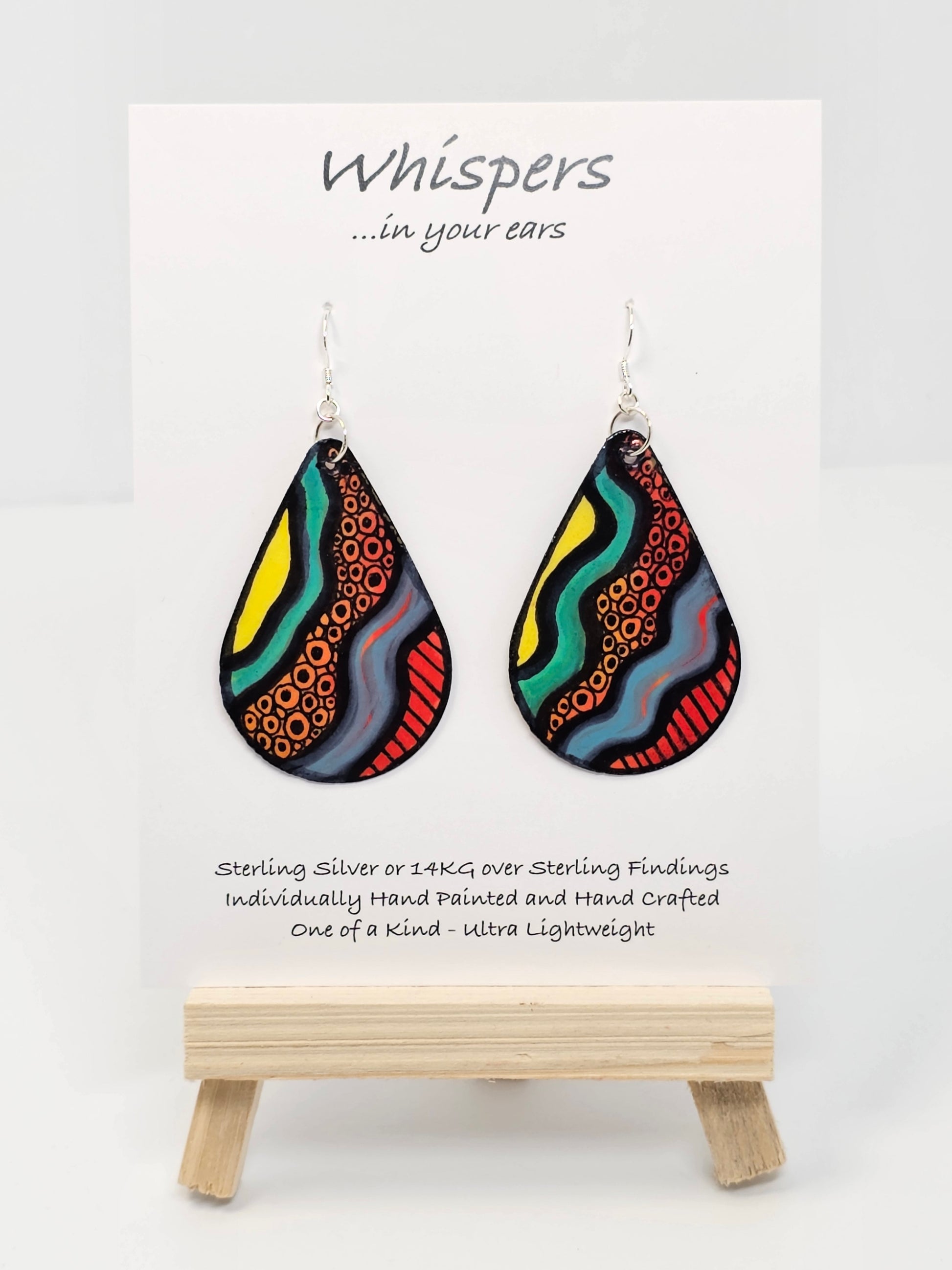 1980s Memphis Design Hand Painted Paper Earrings, 2" Tear drop shape heavy pattern and bold primary colors. Outlined in black. Back of earring similar pattern. Resin coated for durability. Sterling silver ear wires and findings. Ultra light weight. Hangs 2 1/4"