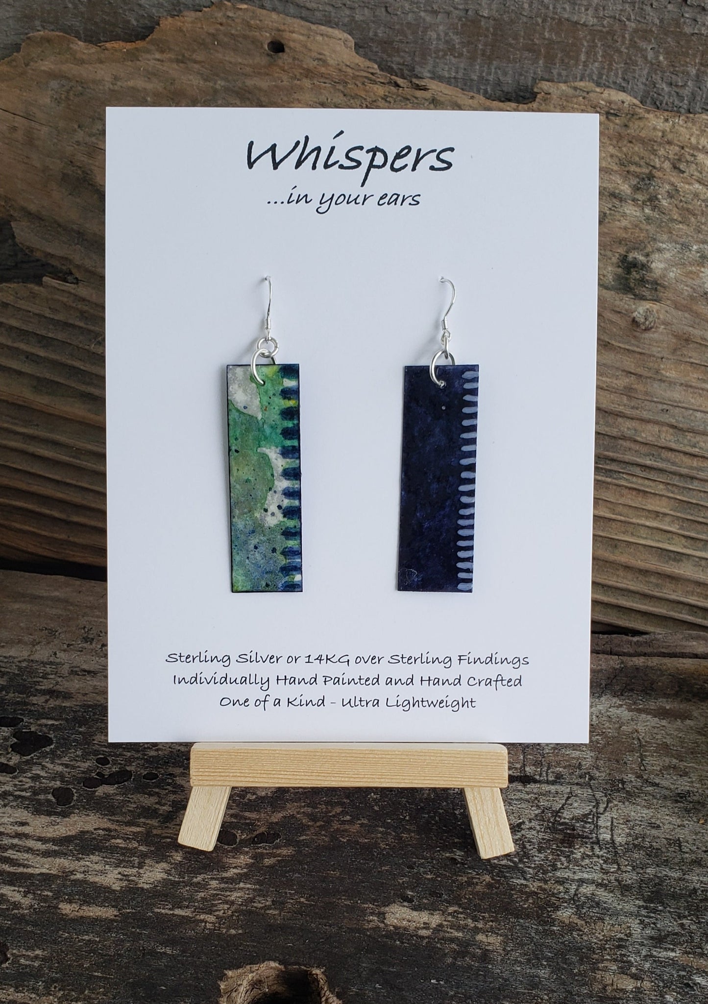 Hand painted watercolor ultra lightweight earrings. Painted  layers of earthy blues and greens with blue stiped edging. Back is painted with complimentary color navy blue and white accent edging.  Elongated rectangle in shape. Sterling silver findings. Hangs 2 1/8" in Length