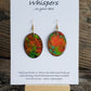 Hand painted watercolor ultra lightweight paper earrings. Shades of red and green with negative space ring lines. Back is painted in a similar complimentary colors. Oval in shape. Hangs 1 1/4" in Length