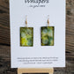 Hand painted watercolor ultra lightweight paper earrings. Greens with white swirly dot accents. Rectangular in shape. Back is painted with complimentary colors. 14kg over silver findings. 1 5/8" in Length