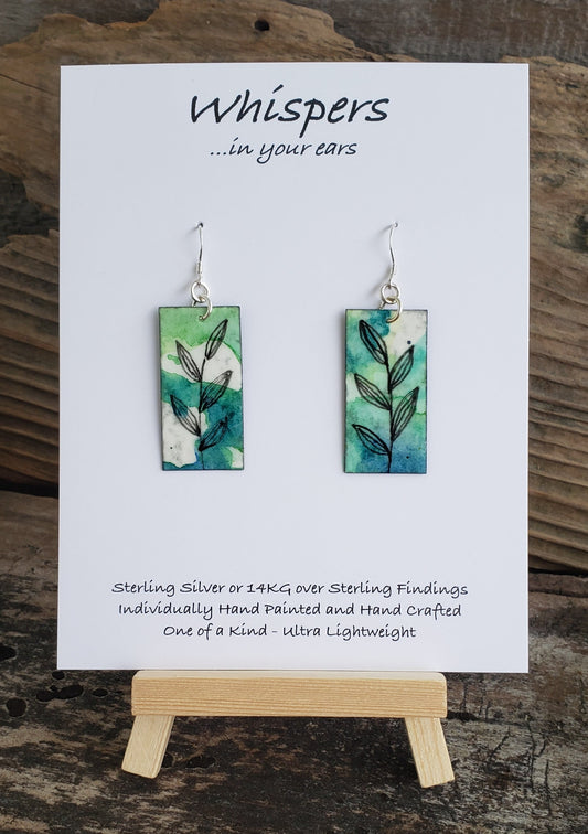 Hand painted watercolor ultra lightweight paper earrings. Blue and green background with Black linear leaf and stem design. Back is painted black. Rectangular in shape. Sterling silver findings. Hangs 1 3/4" in Length