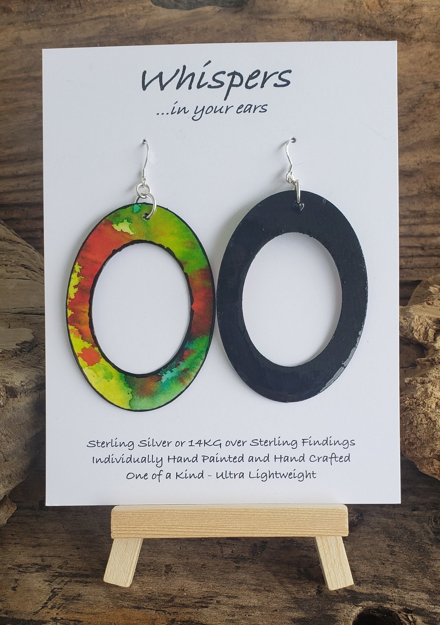 Hand painted watercolor ultra lightweight paper earrings. Graffiti style red splotch layered with bright greens. Edge detailed in black. Back is painted black. Large Statement oval with oval cut out. Sterling silver findings. Hangs 2 3/4" in Length