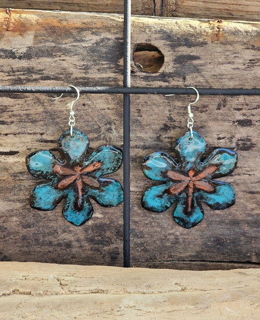 Hand painted watercolor/acrylic Large Copper Metal Dragonfly. Ultra lightweight paper earrings. Faux Patina metal, blue with dark brown detail and embossed copper dragonfly.  Back is painted in a complimentary color. Large Statement Floral in shape. Sterling silver findings. Hangs 2 1/2" in Length