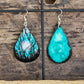 Hand painted watercolor/acrylic Moonlit Forest. Ultra lightweight paper earrings. Nature scape Moon through teal blue sky with  forest silhouette detail.  Back is painted in a complimentary color. Teardrop in shape. Sterling silver findings. Hangs 2 1/2" in Length
