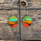 Hand painted Watercolor Desert View Nature scape. Ultra lightweight paper earrings. Teal blue, orange, red and brown background landscape.  Edged in golds. Back is painted in complimentary color. Oval in shape. 14kg over sterling silver findings. Hangs 1 3/4" in Length