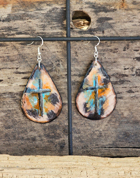 Hand painted Acrylic Mixed Media Cross and Cheetah. Ultra lightweight paper earrings. Beautiful Cross painted on Cheetah print background. Accented with aqua blue and  orange. Edged in Dark brown. Back is complimentary color. Teardrop in shape. Sterling silver findings. Hangs 2 1/2" in Length