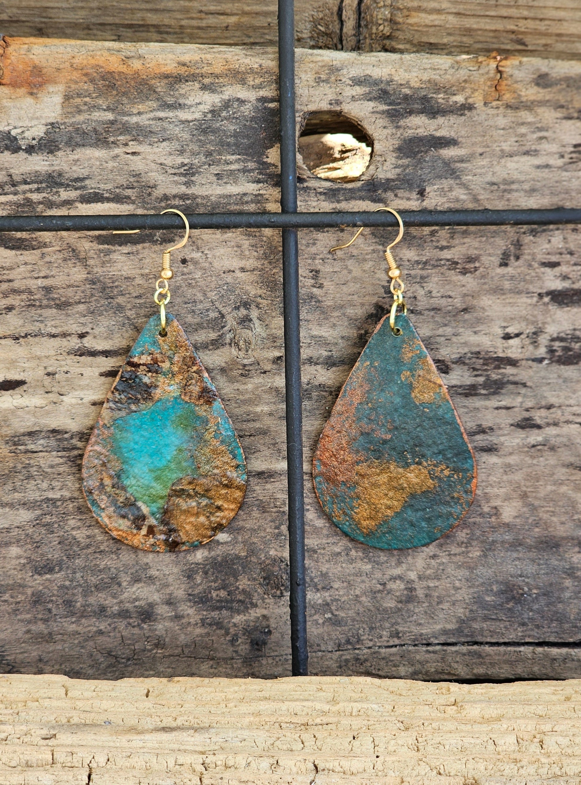 Hand painted Watercolor Mixed Media Collage Tidepool. Ultra lightweight paper earrings. Aqua blue, emerald and lime green background.  Layered collage with copper and bronze painted papers.  Edged in metallics. . Back is painted in complimentary color. Teardrop in shape. 14kg over sterling silver findings. Hangs 2 1/2" in Length