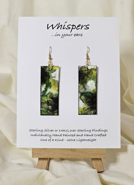 Hand painted watercolor and acrylic ultra lightweight paper earrings. Muted green tones with varying shades of green. Back is painted with similar design and color. Elongated rectangle in shape. 14kg over silver findings. Hangs 2 1/4" in Length