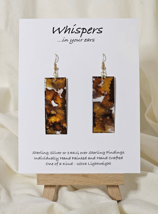 Hand painted watercolor ultra lightweight paper earrings. Muted brown, golden honey and espresso tones. Back is painted with similar design and color. Elongated rectangle in shape. 14kg over silver findings. Hangs 2 1/4" in Length