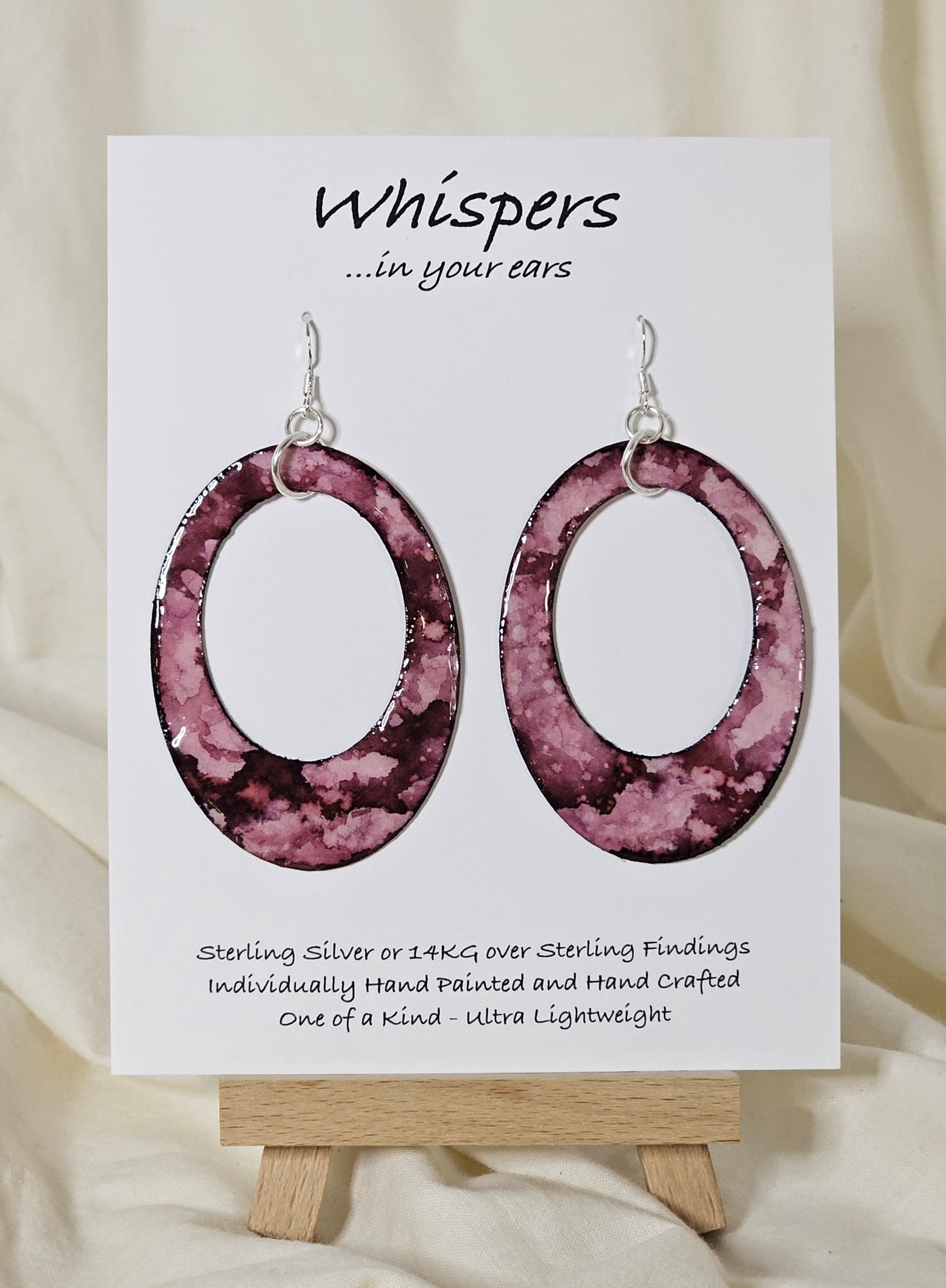 Hand painted watercolor ultra lightweight paper earrings.  Deep purpley pinks and more, organic shape inspired watercolor painting.  Back is painted with the same color and design. 2" Large oval hoop in shape. Sterling silver findings. Hangs 2 3/4" in Length