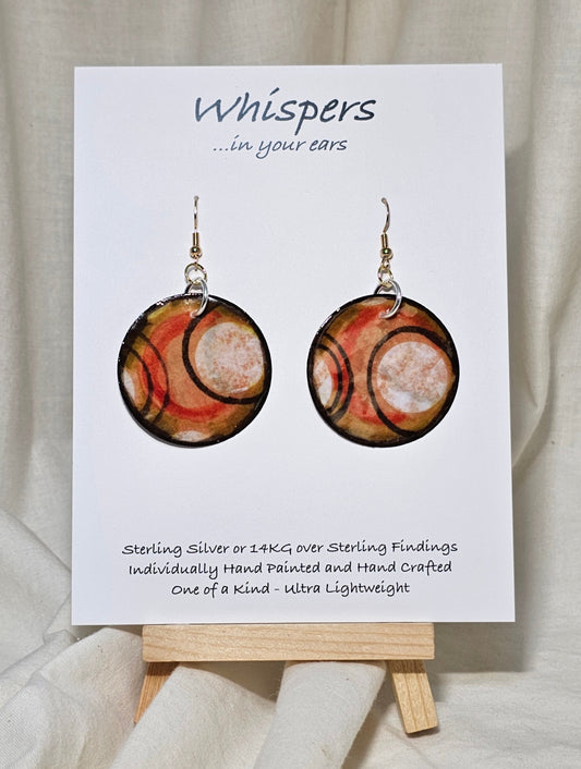 Hand painted Paper earrings. Embellished with acrylics. Look of white dot with black, orange and red lines. Back of earring is painted to match. Ultra lightweight. Resin coated for durability.&nbsp; 1 1/2 in diameter Mix metals Sterling Silver and 14KG over Sterling findings. Hangs 1 3/4" in length