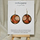 Hand painted Paper earrings. Embellished with acrylics. Look of white dot with black, orange and red lines. Back of earring is painted to match. Ultra lightweight. Resin coated for durability.&nbsp; 1 1/2 in diameter Mix metals Sterling Silver and 14KG over Sterling findings. Hangs 1 3/4" in length