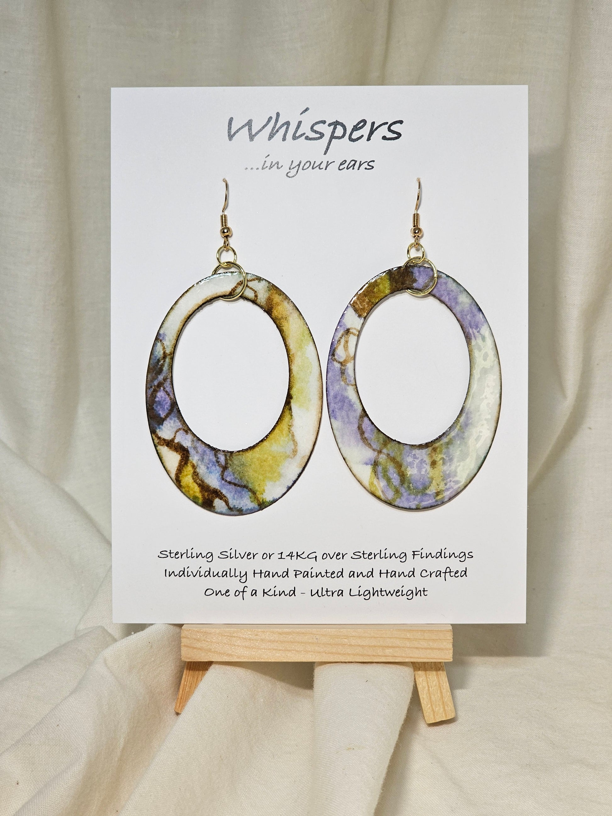 Abstract Periwinkle Mossy Swirl. Hand Painted Paper Earrings. Ultra lightweight, Large statement 2 1/2" Oval. Large oval cut out. Back is painted to match. Resin coating for durability. 14KG over Sterling Silver findings. Hangs 2 3/4" in length