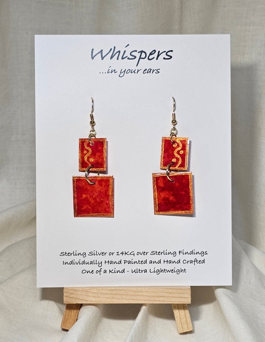 Red n Gold Squared Hand Painted Paper Earrings. 2 Piece dangle red and gold watercolor. Mid size 3/4" and 1" squares. Back is painted to match. Resin coating for durability. 14KG over sterling findings. Hangs 1 7/8" in length