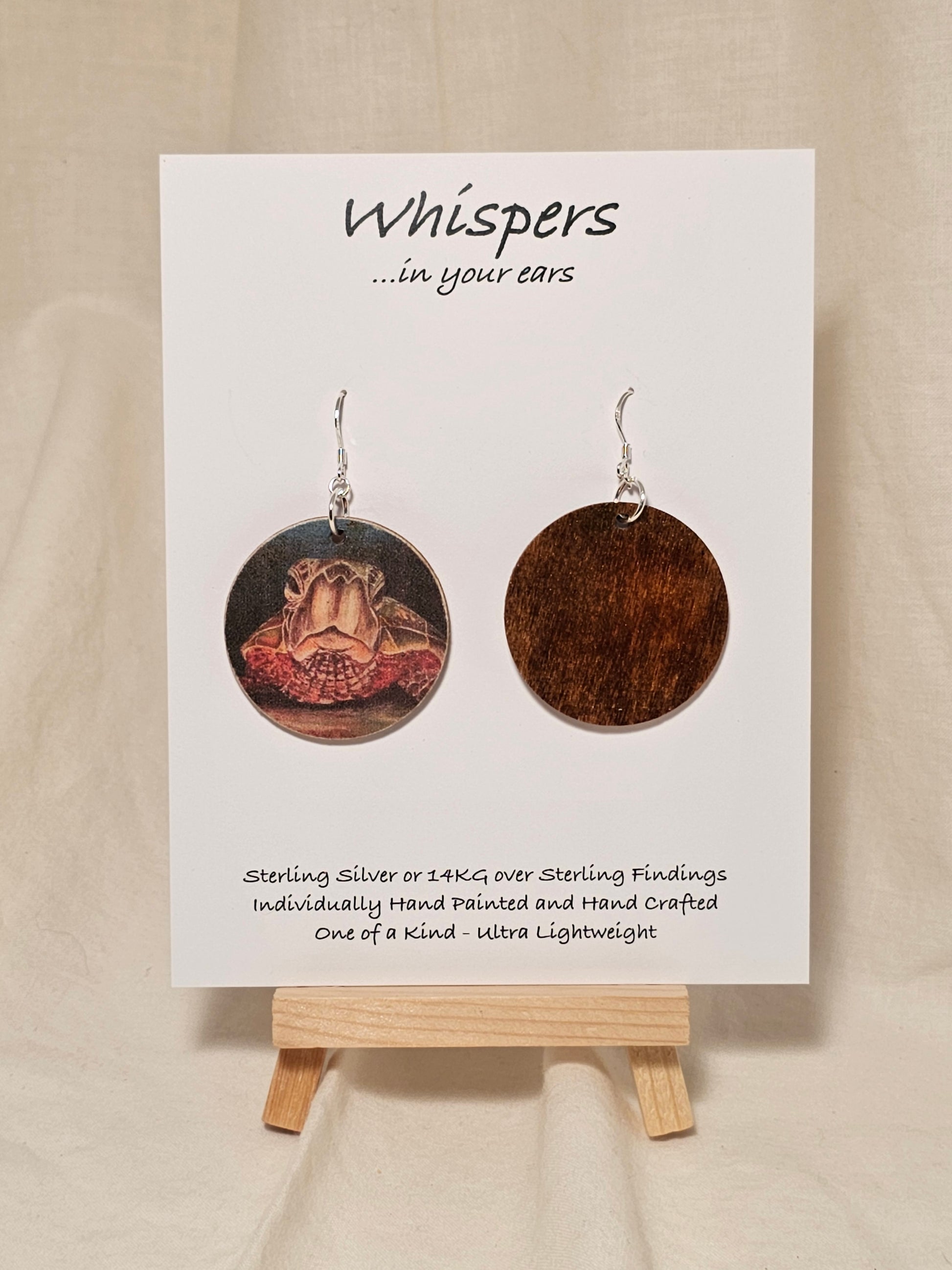 Sea Turtle Art Print Wood Earrings. Art image by Lee M. Hein. Sanded edges distressed look.&nbsp; Back is painted brown wash. 1 1/2" circle. Enameled for durability. Sterling Silver findings. Hangs 1 5/8" in length