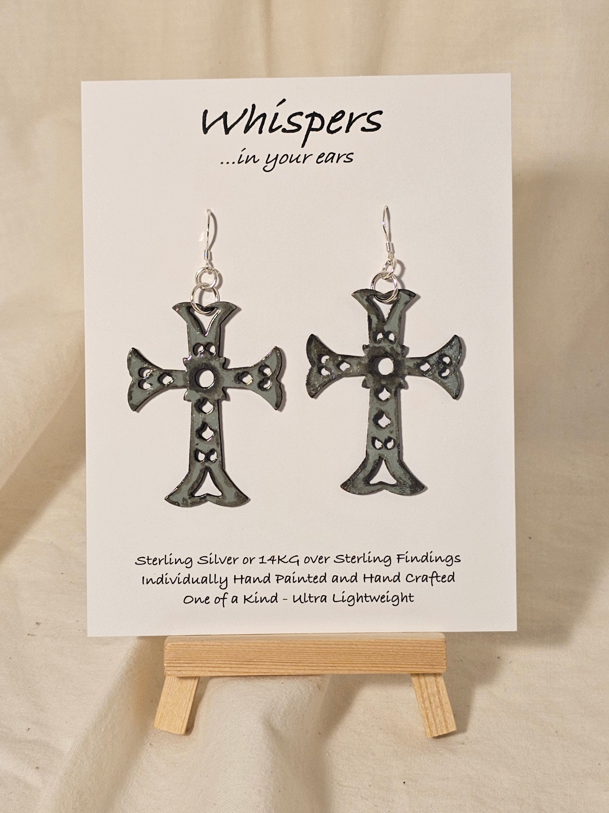 Gray Faux Enameled Wood Cross Hand Painted Earrings. Detailed to look aged. Celtic wooden cross. Back is painted to match. 2" in length. Enameled for durability. Sterling Silver findings. Hangs 2 1/4" in length