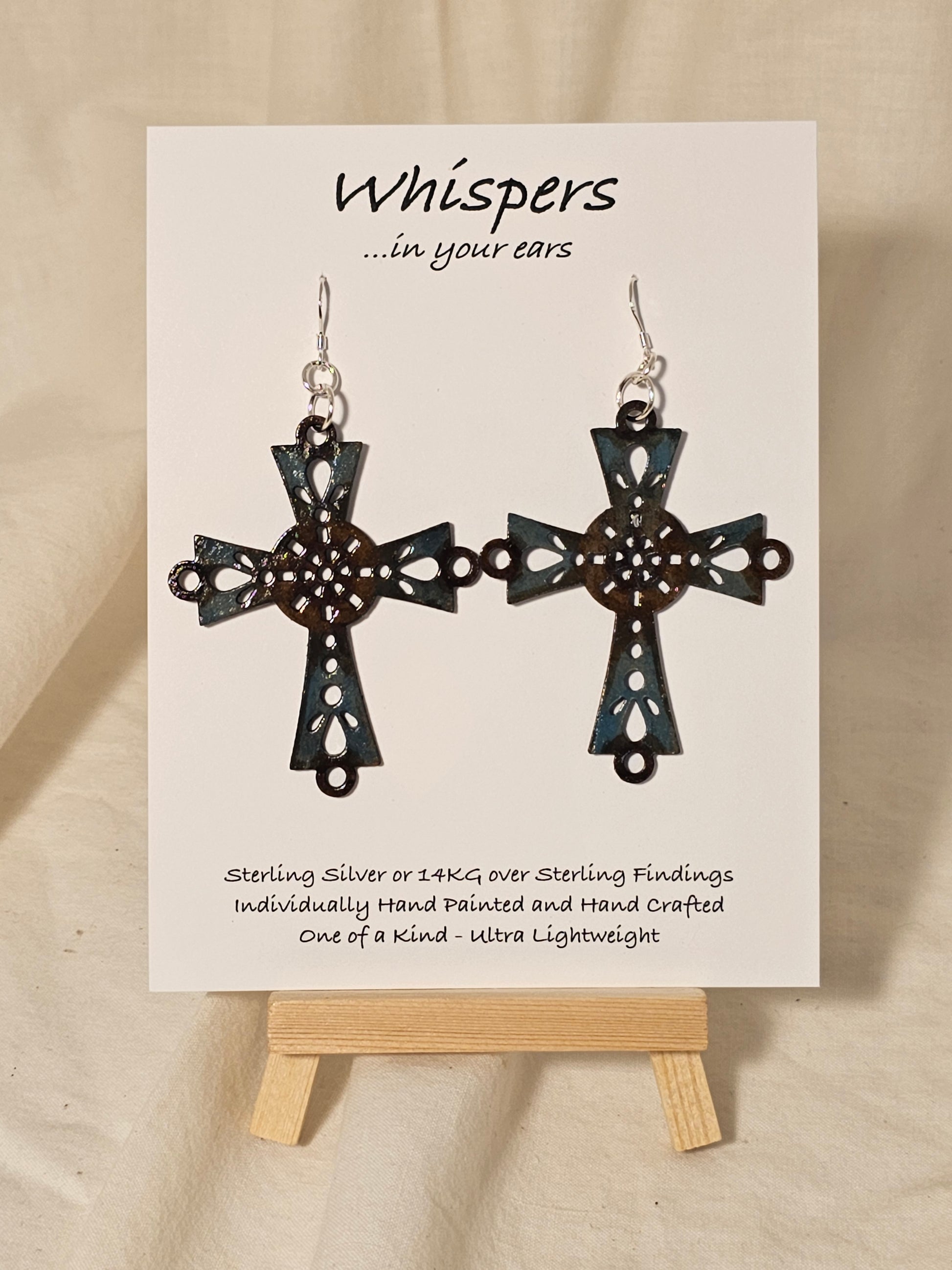 Brown and Turquoise Blue Faux Enamel Hand Painted Celtic Wood Cross Earrings. Cross and circle center painted to look aged and distressed. 2 1/4" Cross. Back is painted to match. Enameled for durability. Sterling Silver findings. Hangs 2 3/4" in length