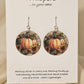 Bright Pumpkin Harvest Art Print Wood Earrings. Artwork by Lee M. Hein. 1 1/2" Circle. Back is painted with light brown wash. Enameled for durability. Sterling findings. Hangs 1 3/4" in length