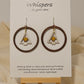 Frosted Gold Star Tree Ring Wood Earrings. Large 1 3/4" Dark wood tone ring with hand painted white tree with gold star pendant hanging in the center. Mixed metal findings. Sterling wires. enameled for durability. Hangs 2" in length