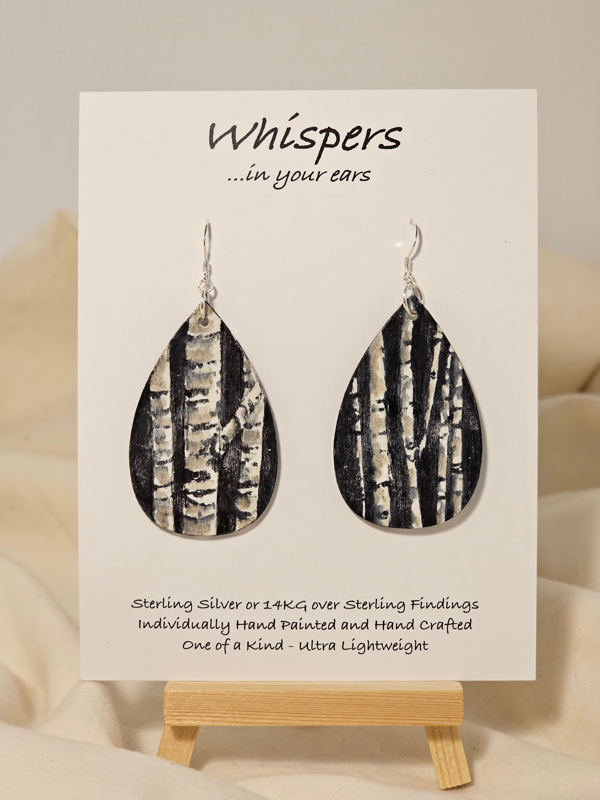 Birch Trees Hand Painted Wood Earrings. 2" Teardrop. Painted birch tree scene on black background. Back is painted to match. Enameled for durability. Sterling Silver findings. Hangs 2 1/2" in length