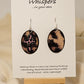 Pink Leopard Cross Hand Painted Paper Earrings. 1 1/2" Oval shaped, Leopard print background with pink leopard print cross. Back is leopard only. Resin coating for durability. Sterling Silver findings. Hangs 1 3/4" in length