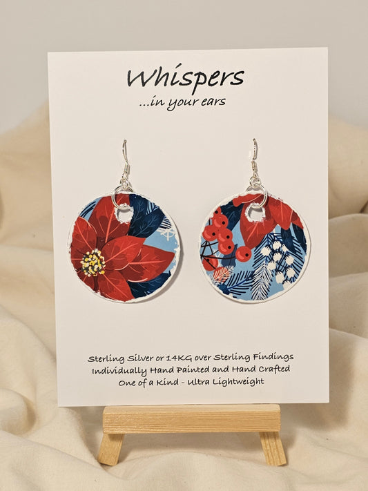 Poinsettia Embossed Repurposed Card Paper Earrings. 1 3/4" Circle edge painted and embellished with white texture. Back is complimentary design. Resin coating for durability. Sterling Silver findings. Hangs 2" in length