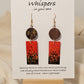 Metallic Confetti Hand Painted Paper and Wood Earrings. Paper hand painted Red with metallic accents. Hanging from embellished wooden disc. Back is painted to match.&nbsp; Resin coating for durability. Mixed metal findings. 14KG over sterling ear wires. Hangs 2 3/4" in length