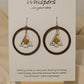 Frosted Gold Star Tree Ring Wood Earrings. Large 1 3/4" Dark wood tone ring with hand painted white tree with gold star pendant hanging in the center. Mixed metal findings. Sterling wires. enameled for durability. Hangs 2" in length