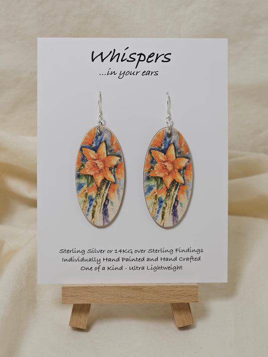 Daffodil Art Print Wood Earrings. Artwork by Lee M. Hein. Elongated wood oval with watercolor print of Daffodil. Back is brown wash. Enameled for durability. Sterling Silver findings Hangs 2 1/4" in length