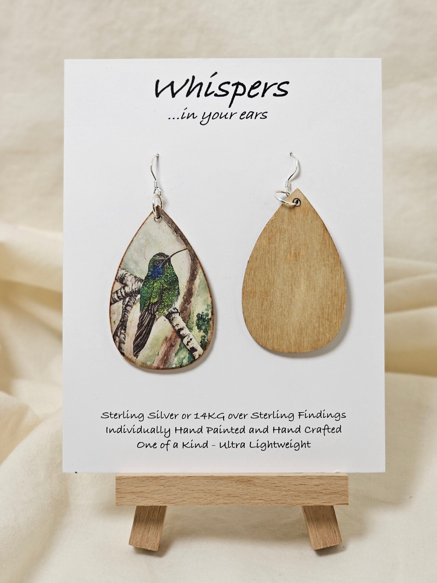 Hummingbird Art Print Wood Earrings. Artwork by Lee M. Hein. 2" Tear drop. Watercolor image of Hummingbird in tree. Back is painted with light brown wash. Enameled for durability. Sterling silver findings. Hangs 2 1/4" in length
