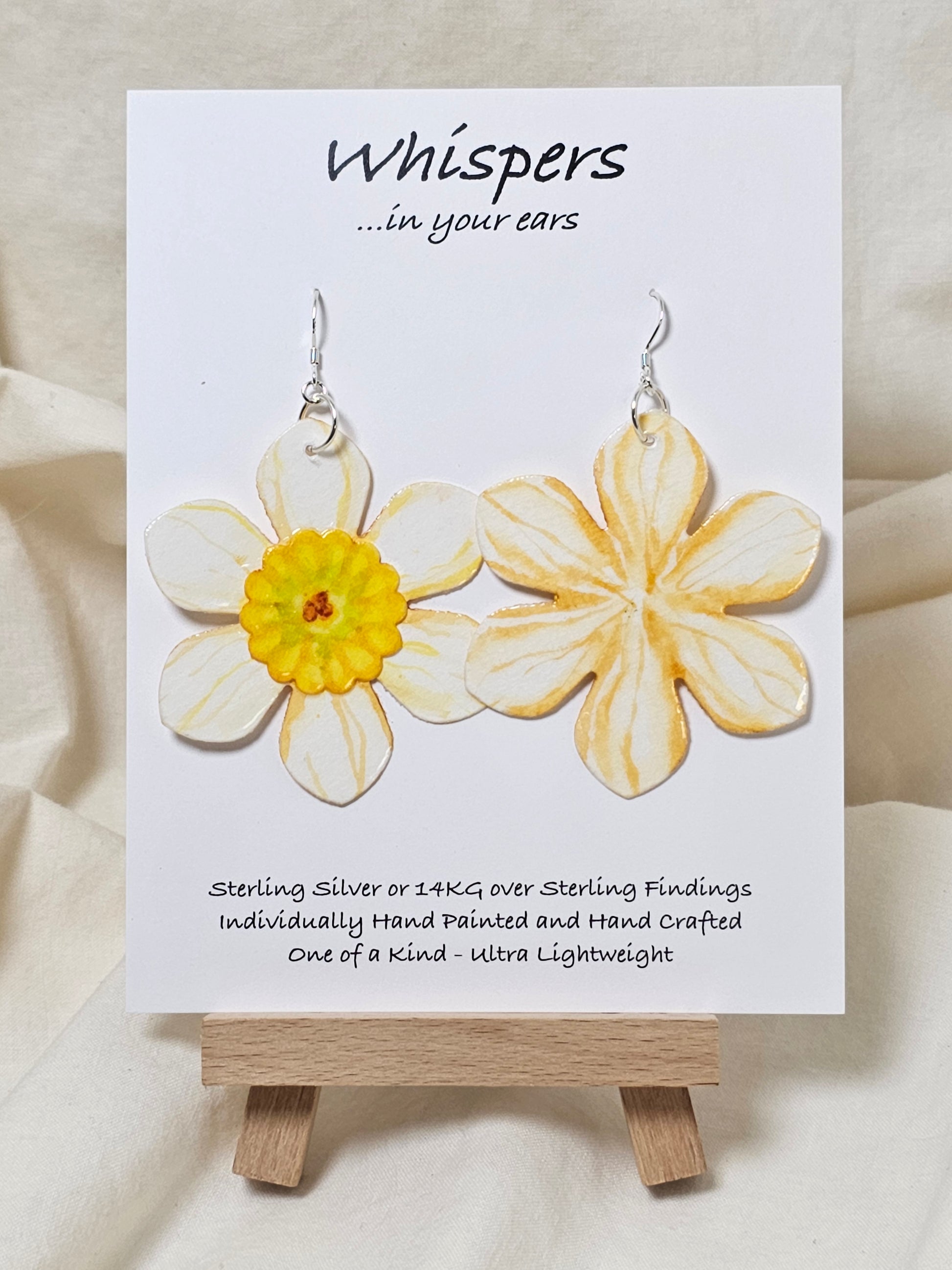 Yellow Burst Layered Flower Hand Painted Paper Earrings. Ultra lightweight 2 1/2" in diameter. Watercolor painted to resemble bright White and yellow flower with deep yellow veining. Center is separate layer painted. Back is painted in complimentary colors. Resin Coating for durability. Sterling Silver findings. Hangs 2 5/8" in length