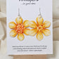 Tangerine Daffodil Flower Hand Painted Paper Earrings. Ultra lightweight 2 1/2" in diameter. Watercolor painted to resemble bright yellow and orange daffodil. Back is painted in complimentary colors. Resin Coating for durability. Sterling Silver findings. Hangs 2 5/8" in length