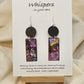 Black Spiral Motif Hand Painted Paper and Wood Earrings. 3/4" x 1 5/8" Paper Rectangle hand painted brightly colored background with black swirl accents. Edged in black. Hanging from embellished wooden disc painted black. Back is painted to match. Resin coating for durability. Sterling Silver findings. Hangs 2 1/2" in length