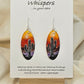 Desert Sunset Hand Painted Paper Earrings.&nbsp; Ultra lightweight 2" Elongated oval. Features Cactus in silhouette. Vibrant orange yellow and purple sky. Painted dark edge. Back is painted with similar color. Resin coating for durability. Sterling Silver findings. Hangs 2 1/8" in length