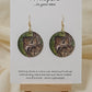 Owl Art Print Dark Wood Earrings. Artwork by Lee M. Hein. 1 1/2" Circle. Back is painted with dark brown wash. Enameled for durability. 14KG over Sterling findings. Hangs 1 3/4" in length