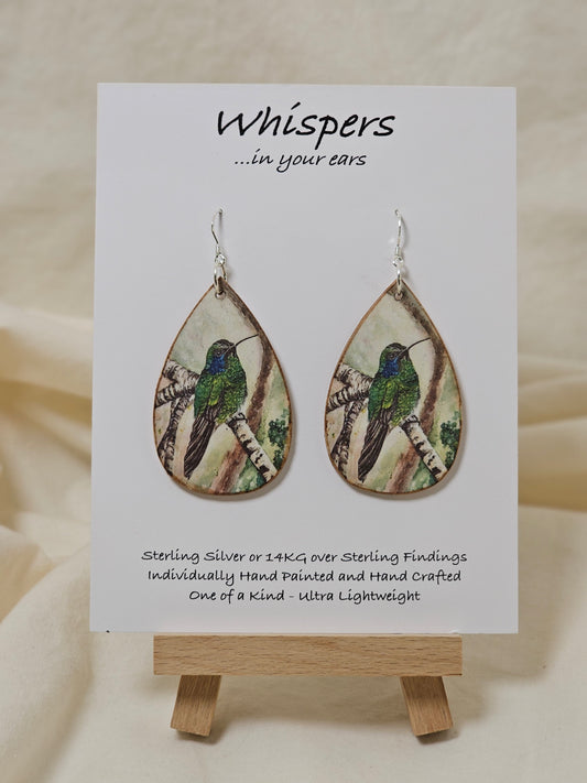 Hummingbird Art Print Wood Earrings. Artwork by Lee M. Hein. 2" Tear drop. Watercolor image of Hummingbird in tree. Back is painted with light brown wash. Enameled for durability. Sterling silver findings. Hangs 2 1/4" in length