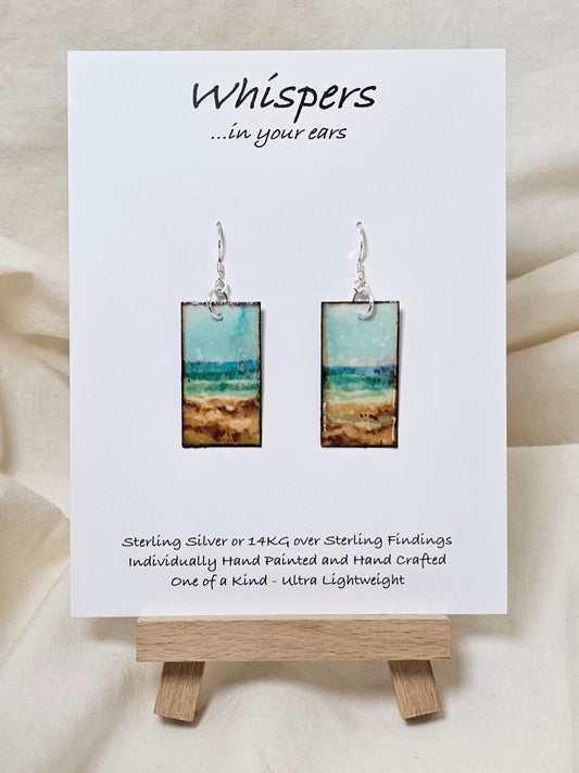 Vintage Beach Scape Hand Painted Paper Earrings. Ultra lightweight 1 3/8" Rectangle, painted in watercolor with aged paper look. Back painted with complimentary design. Resin coating for durability. Sterling Silver findings. Hangs 1 1/2" in length