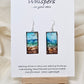 Blowing Ocean Scape Hand Painted Paper Earrings. Ultra lightweight ! 1/2" Rectangle painted in watercolor. Abstract ocean scape. Aqua, blues and browns. Back is painted similar design. Resin coating for durability. Sterling silver findings. Hangs 1 3/4" in length