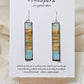 Vintage Beach Reflections Hand Painted Paper Earrings. Ultra lightweight 1/2" x 2 1/2" elongated rectangle. Watercolor abstract beach reflection. Distressed edge in brown. Back is painted with similar design. Resin coating for durability. Sterling Silver findings. Hangs 2 3/4" in length