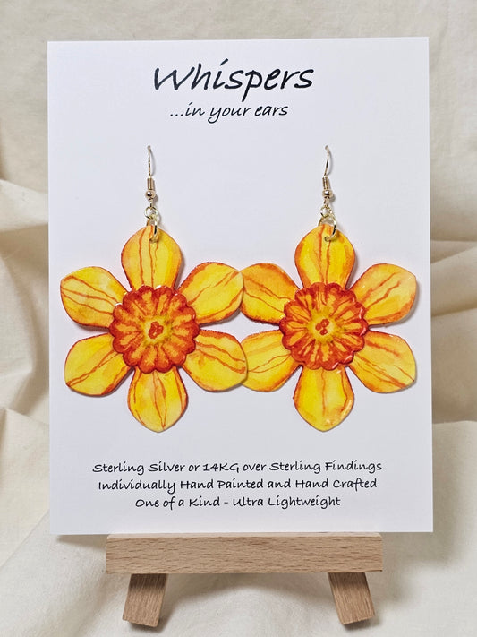 Orange Burst Layered Flower Hand Painted Paper Earrings. Ultra lightweight 2 1/2" in diameter. Watercolor painted to resemble bright Orange yellow flower with deep orange veining. Center is separate layer painted. Back is painted in complimentary colors. Resin Coating for durability. Mixed Metas 14KG over sterling and Sterling Silver findings. Hangs 2 5/8" in length