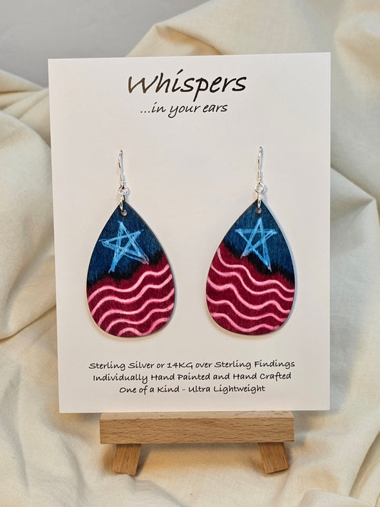 Americana Wood Earrings. 2" Tear drop. Painted in watercolor and acrylic stars and stripes. Red, white and blue. Back is painted to match. Enameled for durability. Sterling silver findings. Hangs 2 1/4" in length