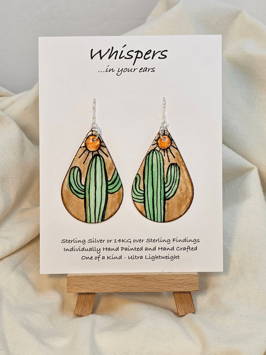 Sunburst Cactus hand painted watercolor paper earrings. Ultra lightweight.&nbsp; Tans and Muted greens. Dark brown edge detail. Back is painted with similar colors and design. Tear drop in shape. Resin coating for durability. Sterling silver findings. Hangs 2 1/4" in length