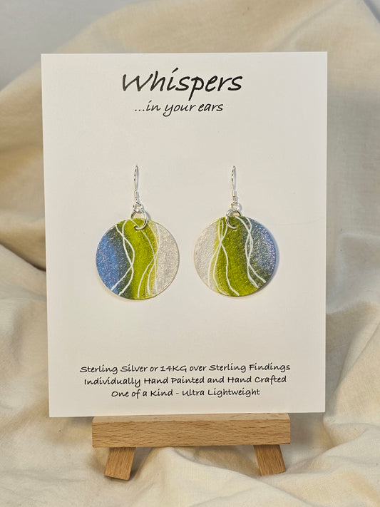 Pearl Swirl Iridescent Hand Painted Watercolor Paper Earrings. Ultra lightweight 1 1/4" Circle abstract watercolor painting periwinkle blue, lime green and pearlized white accents. Back is painted to match. Resin coating for durability. Sterling findings. Hangs 1 1/2" in length